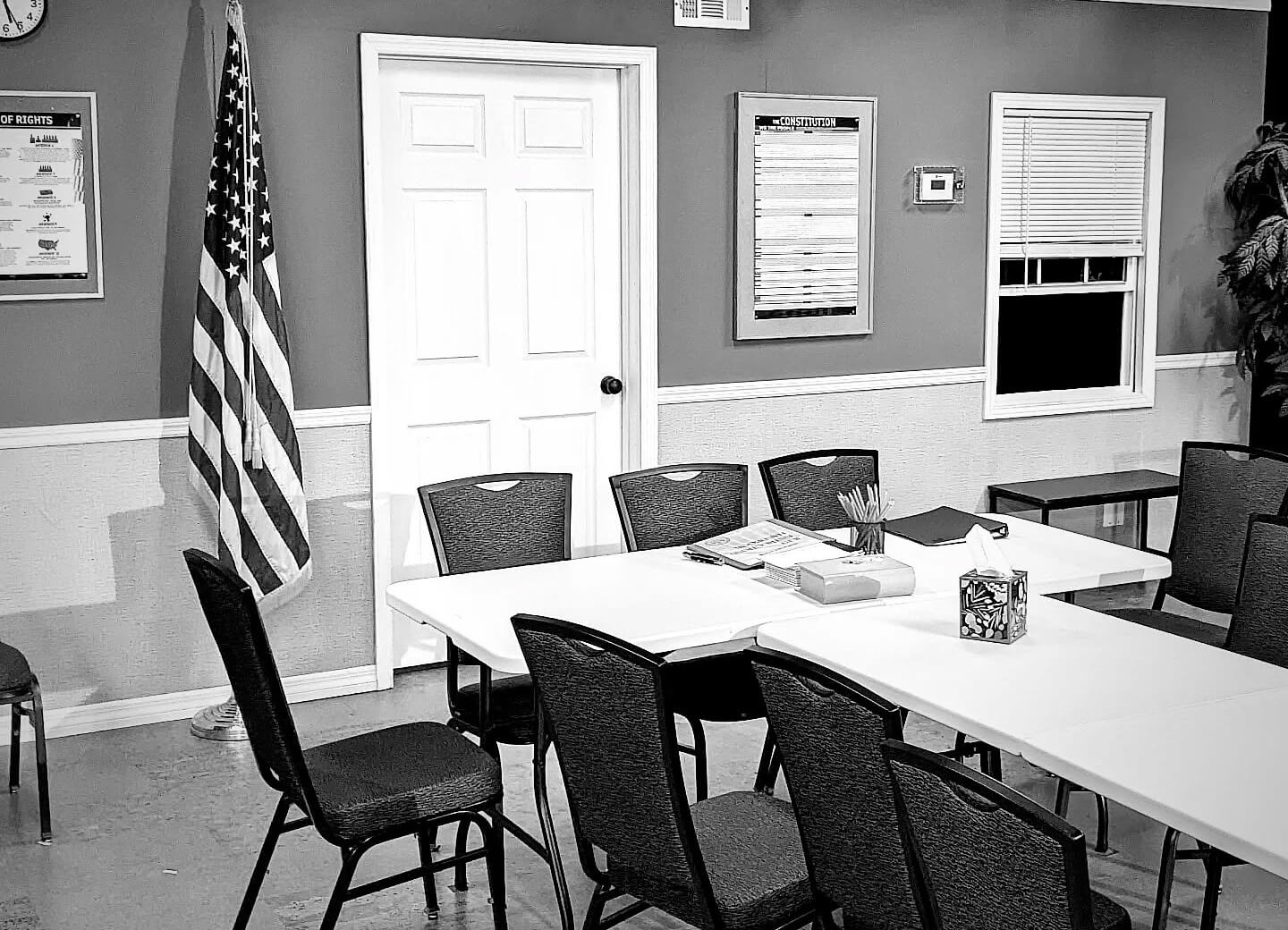 chairs at a table inside a small room