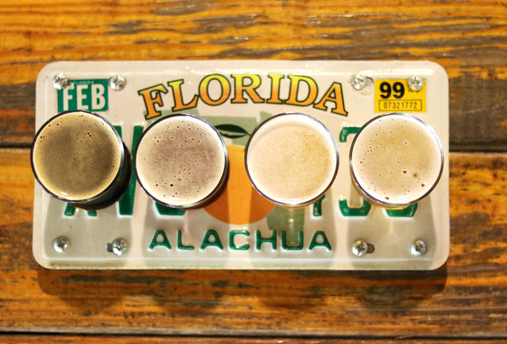 Flights of beer served in a Florida license plate at First Magnitude Brewing Co