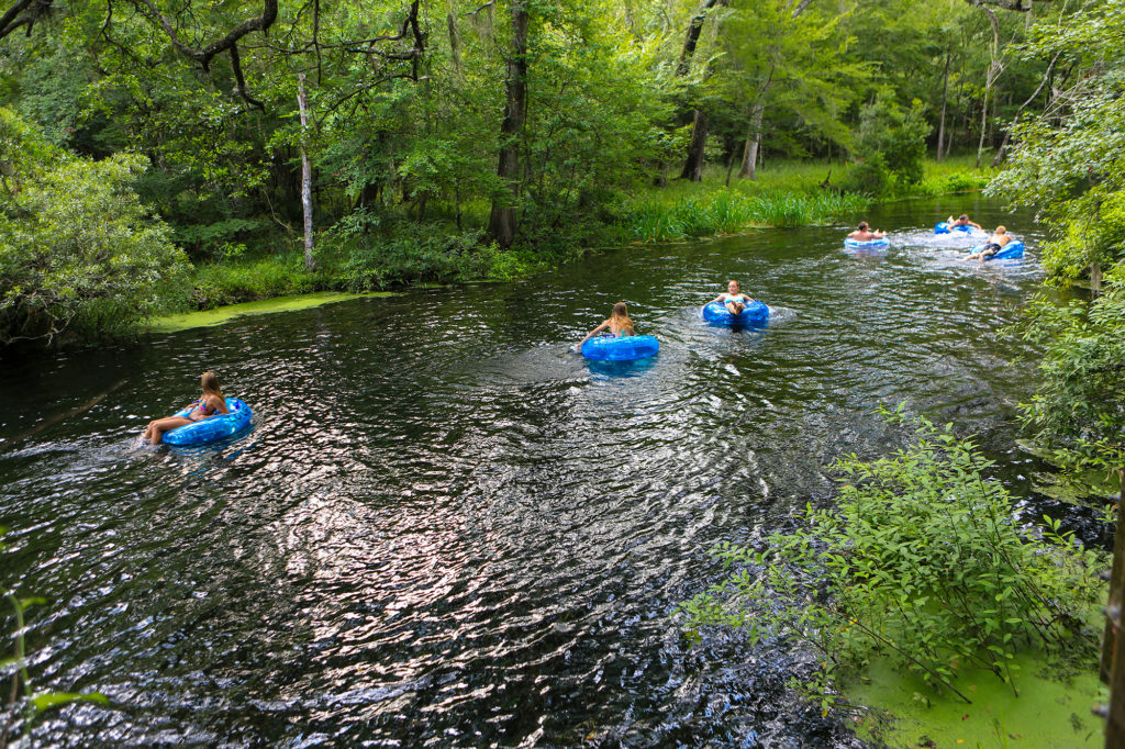people floating on rafts down the spring fed river at itchetucknee springs state park