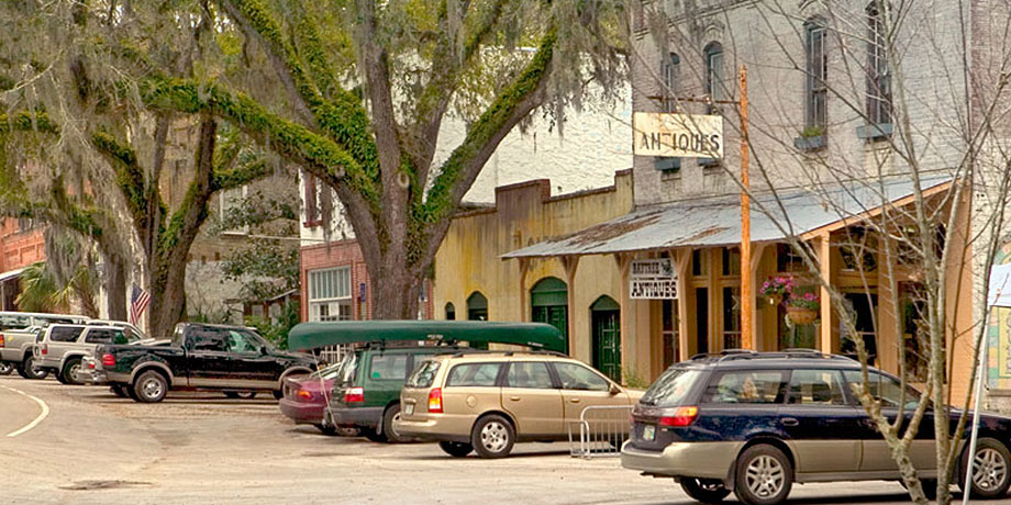 Cars parked in historic downtown micanopy