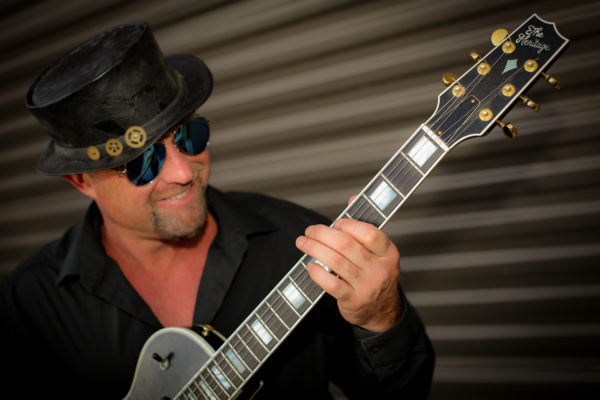 Shane Dwight with guitar