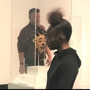 Jahdayna and Paris study West African masks at the Harn Museum