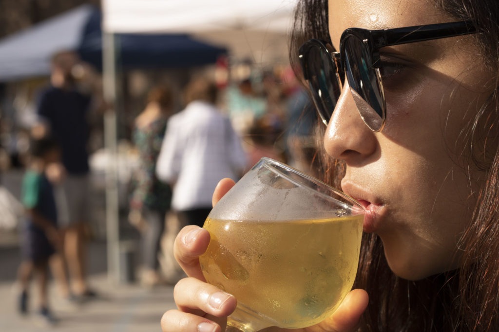 Sipping from a glass at festival