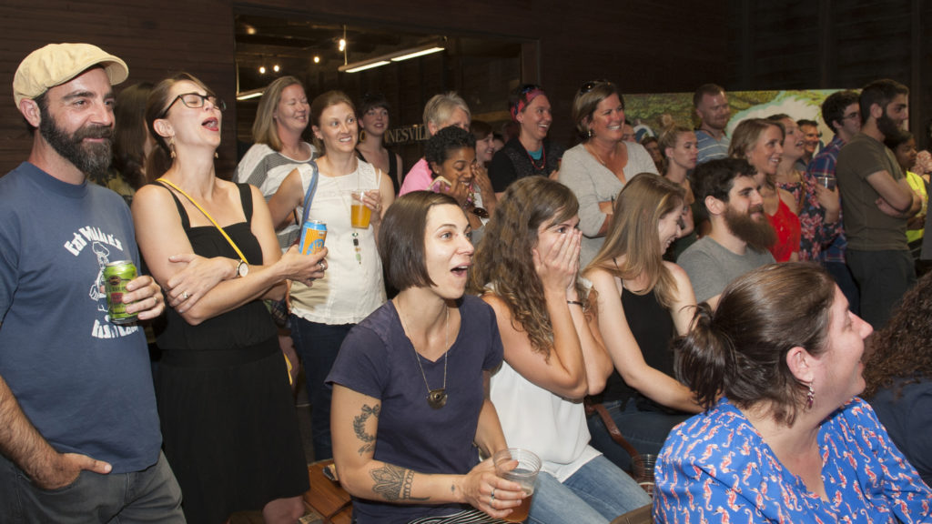 Crowd reacting to wild stories at Pants on Fire
