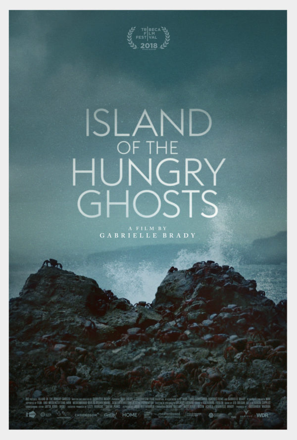 Movie poster for Island of the Hungry Ghosts. A film by Gabrielle Brady. crabs crawling on rocks by the beach.