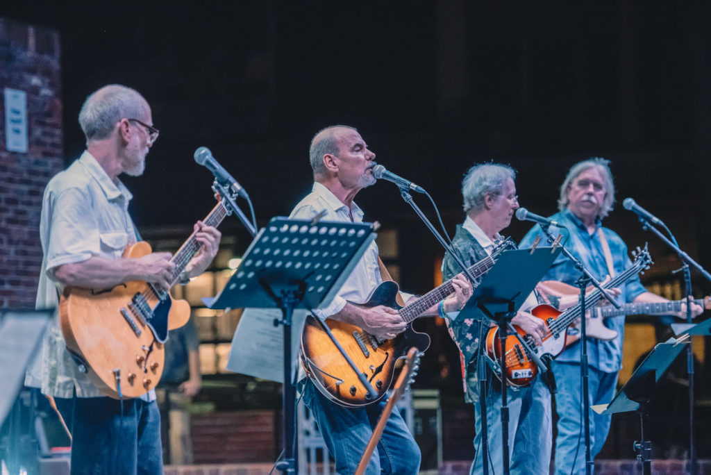 The Impostors performing on stage