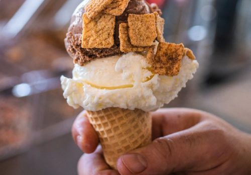 Ice cream cone topped with cinnamon toast crunch cereal