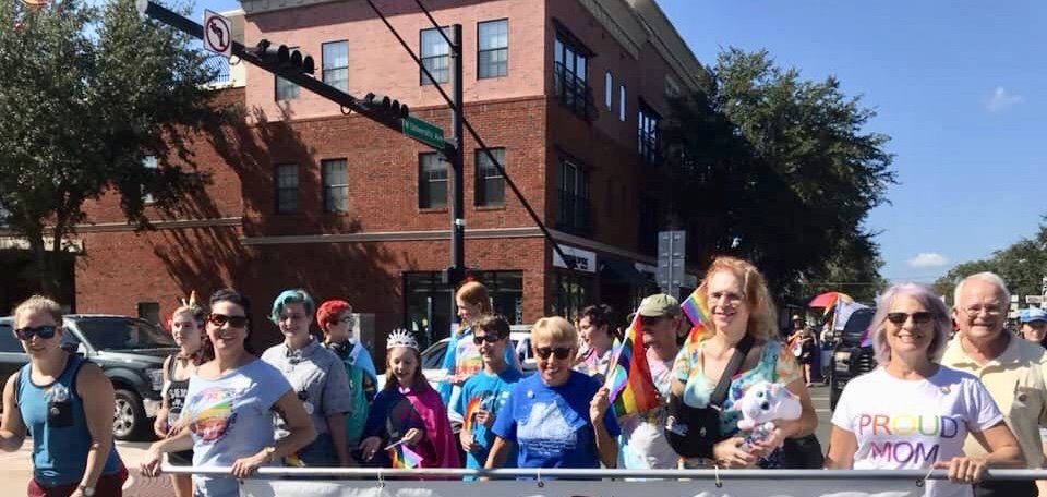 People marching in the Pride Parade along University Ave