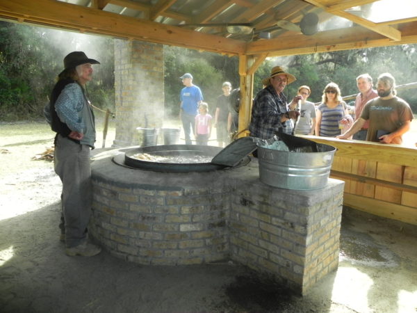 Boiling sugar cane juice into syrup