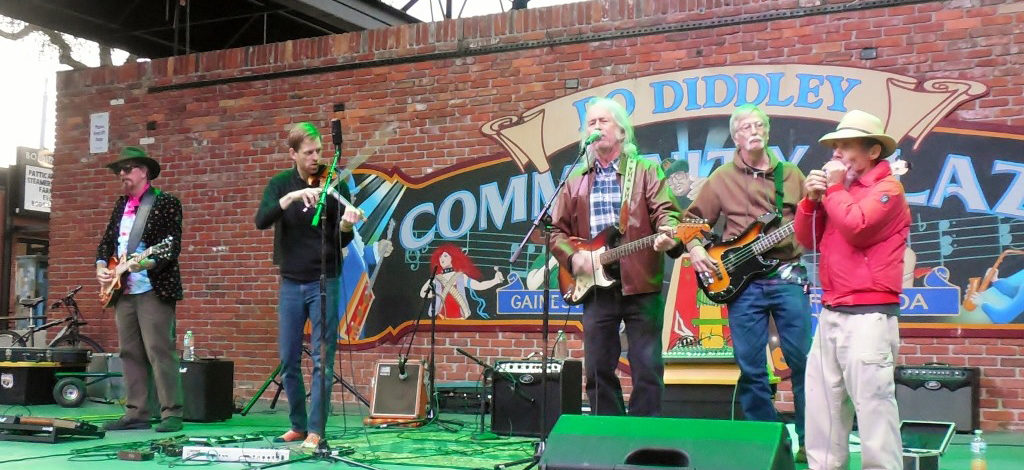 Musicians on stage at Bo Diddley Plaza