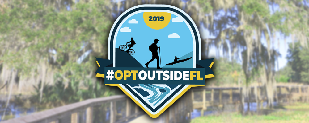 Logo for 2019 #OptOutsideFL boardwalk at la chua trail in the background