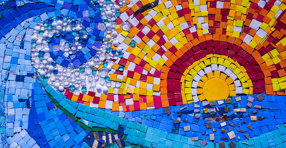 Artwork of a Blue Wave and Sunset made from trash