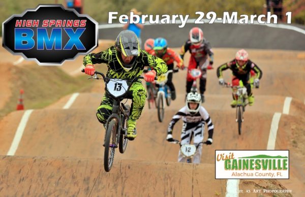 BMX riders racing on the track