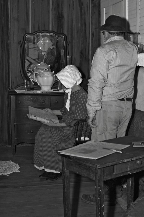 People inside old home Discussing the days events