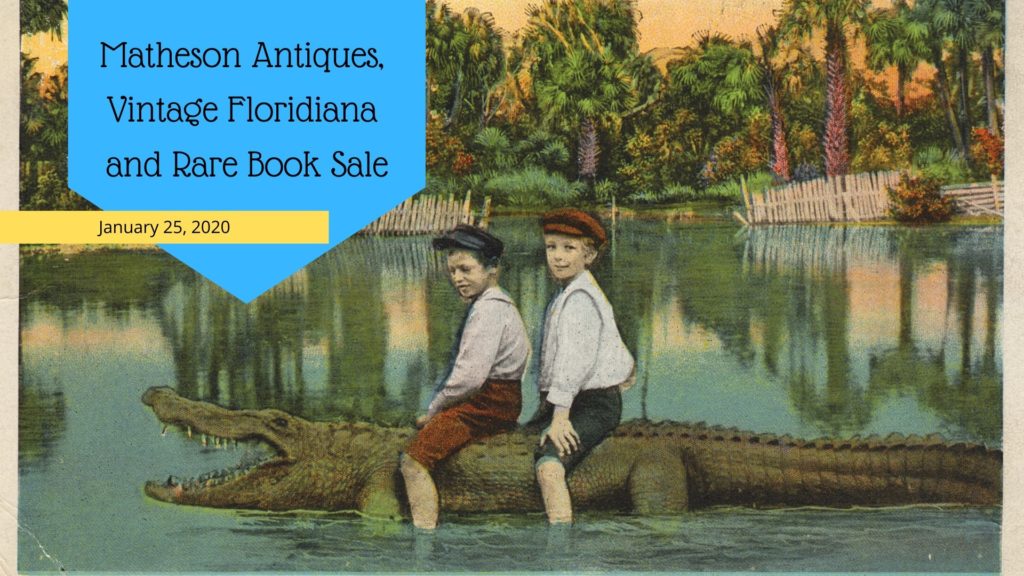 old postcard depicting two boys riding an alligator