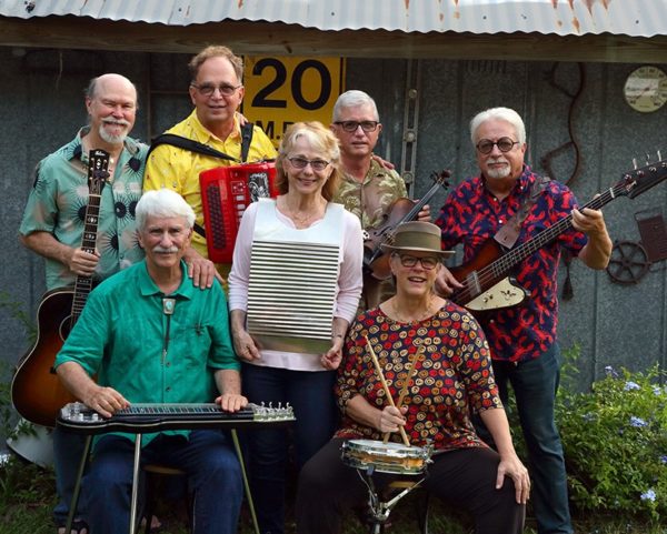 Band members of Gumbo Limbo band with instruments