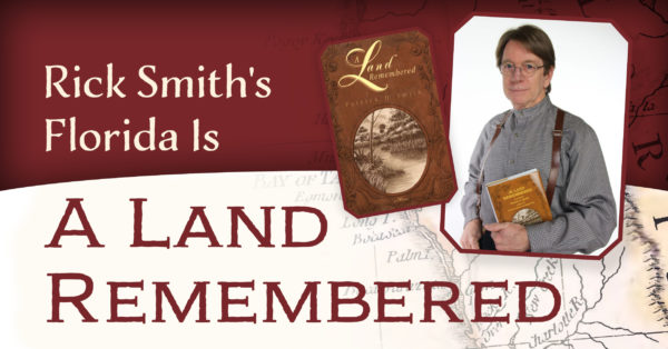 Photo of Rick Smith holding his father's book "A Land Remembered"