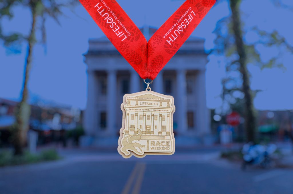 Race medal for Race Weekend in front of The Hippodrome