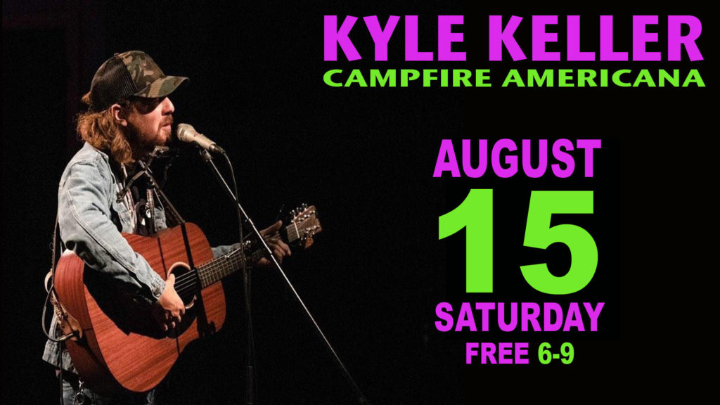 kyle keller performing with guitar