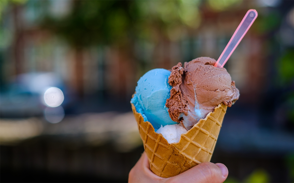 hand holding an ice cream waffle cone