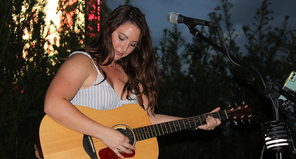 musician hannah love with guitar