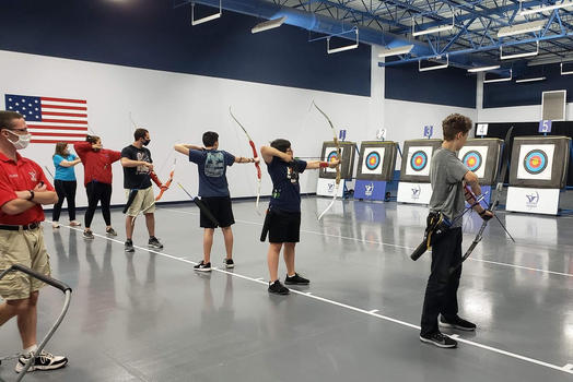 archers aiming at targets