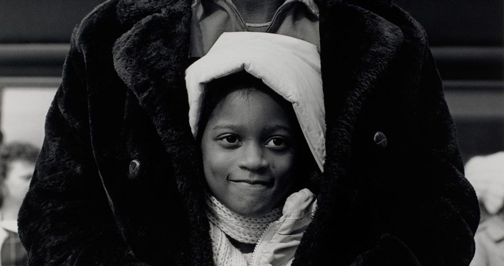 child smiling in the arms of father