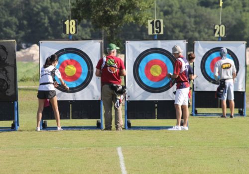 archers standing next to targets
