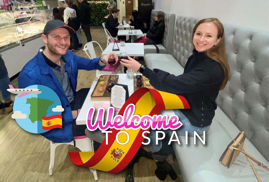 people in restaurant with wine and macarons
