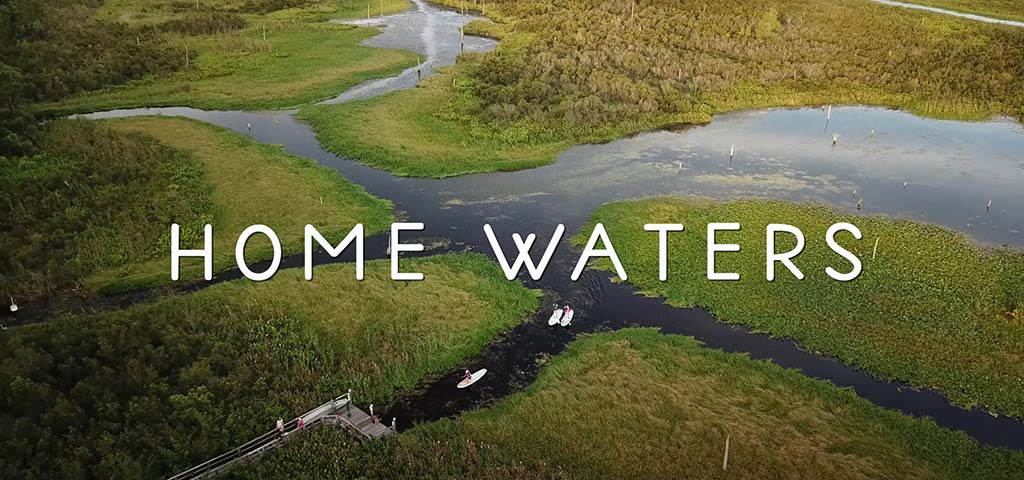 water way and paddleboarders