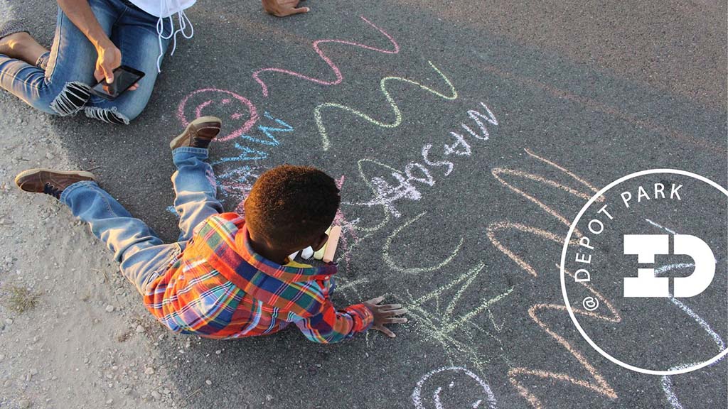 chalk on sidewalk at depot park