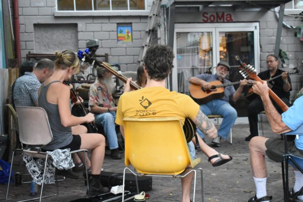 Photo of a group of musicians playing old-time music together.