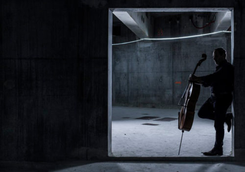 man holding cello