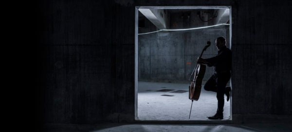 man holding cello