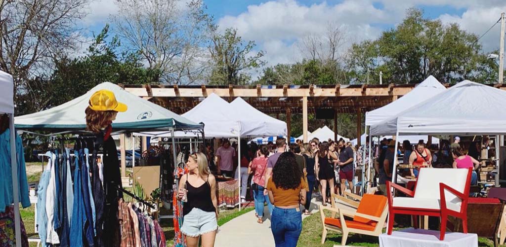 people shopping at the outdoor market