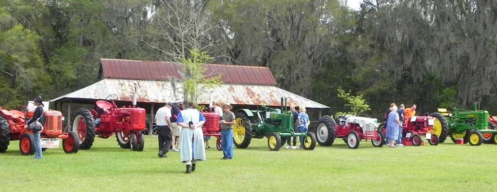 people looking at old tractors