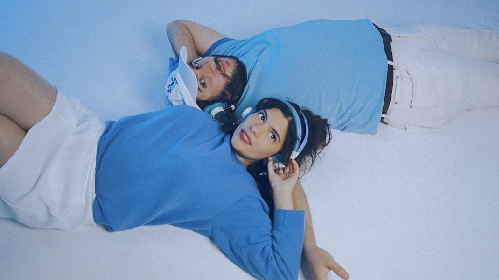 man and woman dressed in blue and white