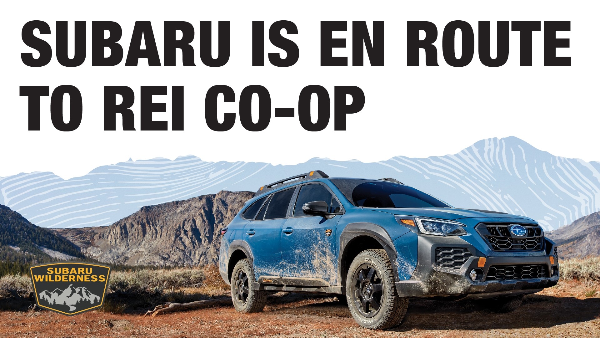 subaru is en route to rei co-op. image of subaru wilderness on dirt road with mountains in the background
