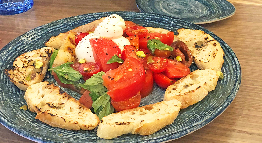 tomato and buratta salad at spurriers gridiron grille