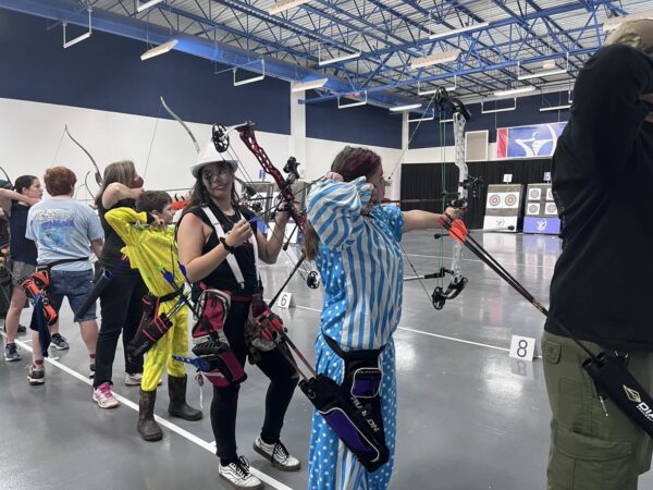 archers taking aim in costume