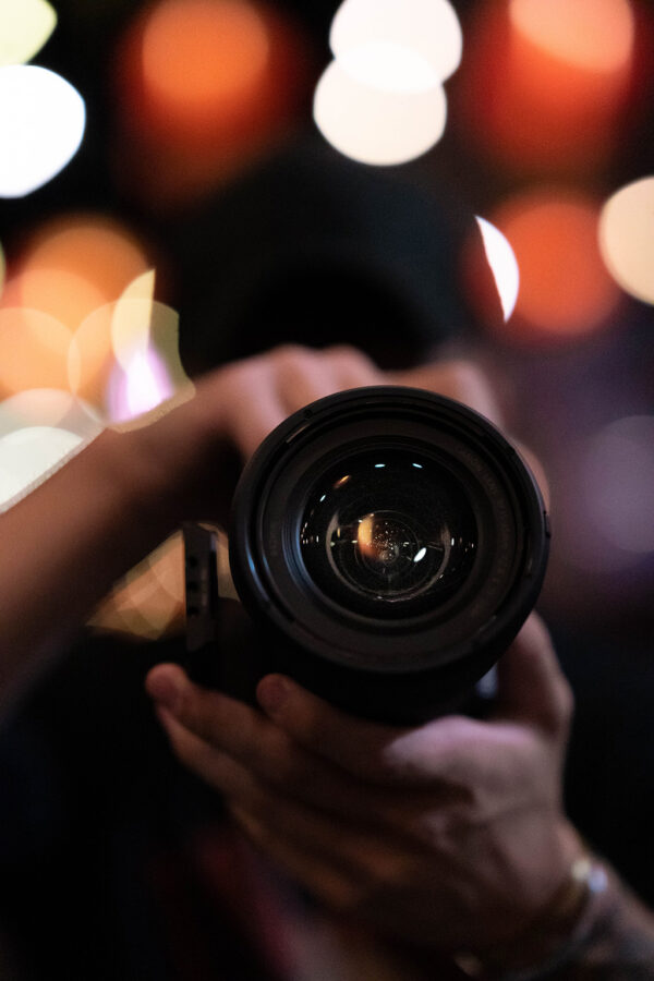 Person holding camera pointed at the viewer