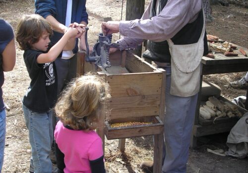 kids around corn sheller