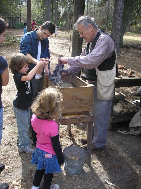 kids around corn sheller