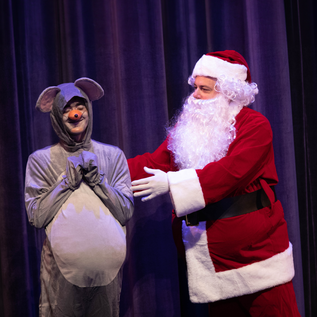 state performers in costume as mouse and santa claus