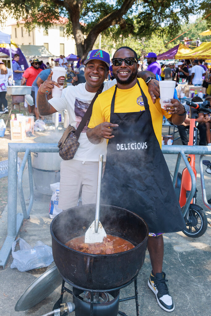 people cooking at a tailgate