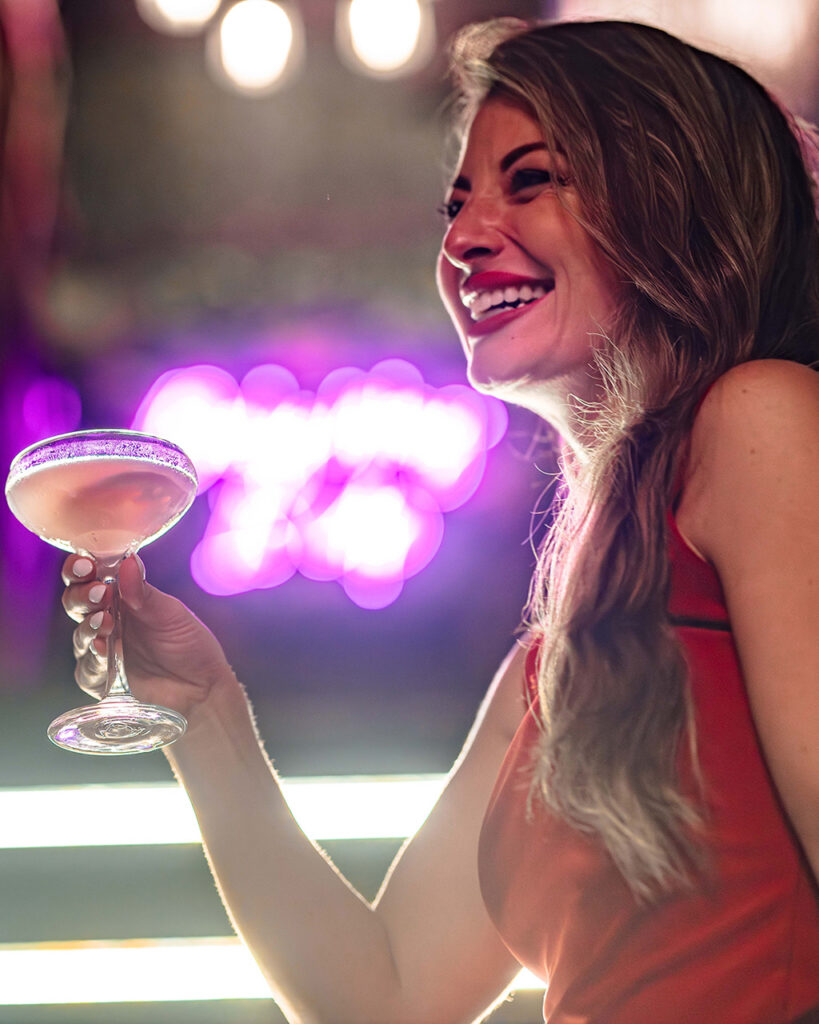 person enjoying a cocktail