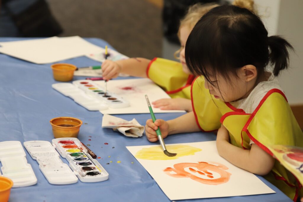 child participating in an art activitiy