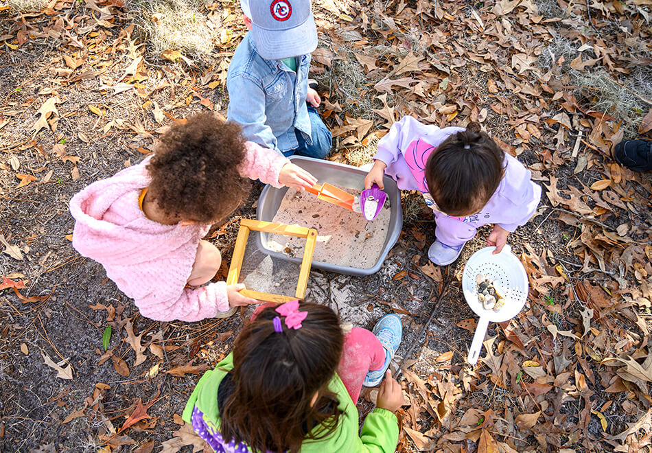 overhead angle of kids engaging with a hands on activity