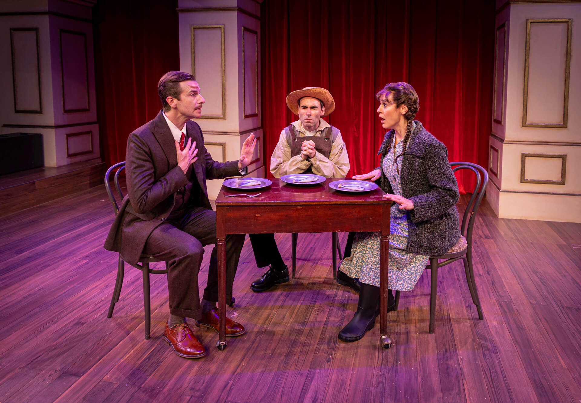 actors on stage at a dinner table for the production of 39 Steps at the Hippodrome Theatre