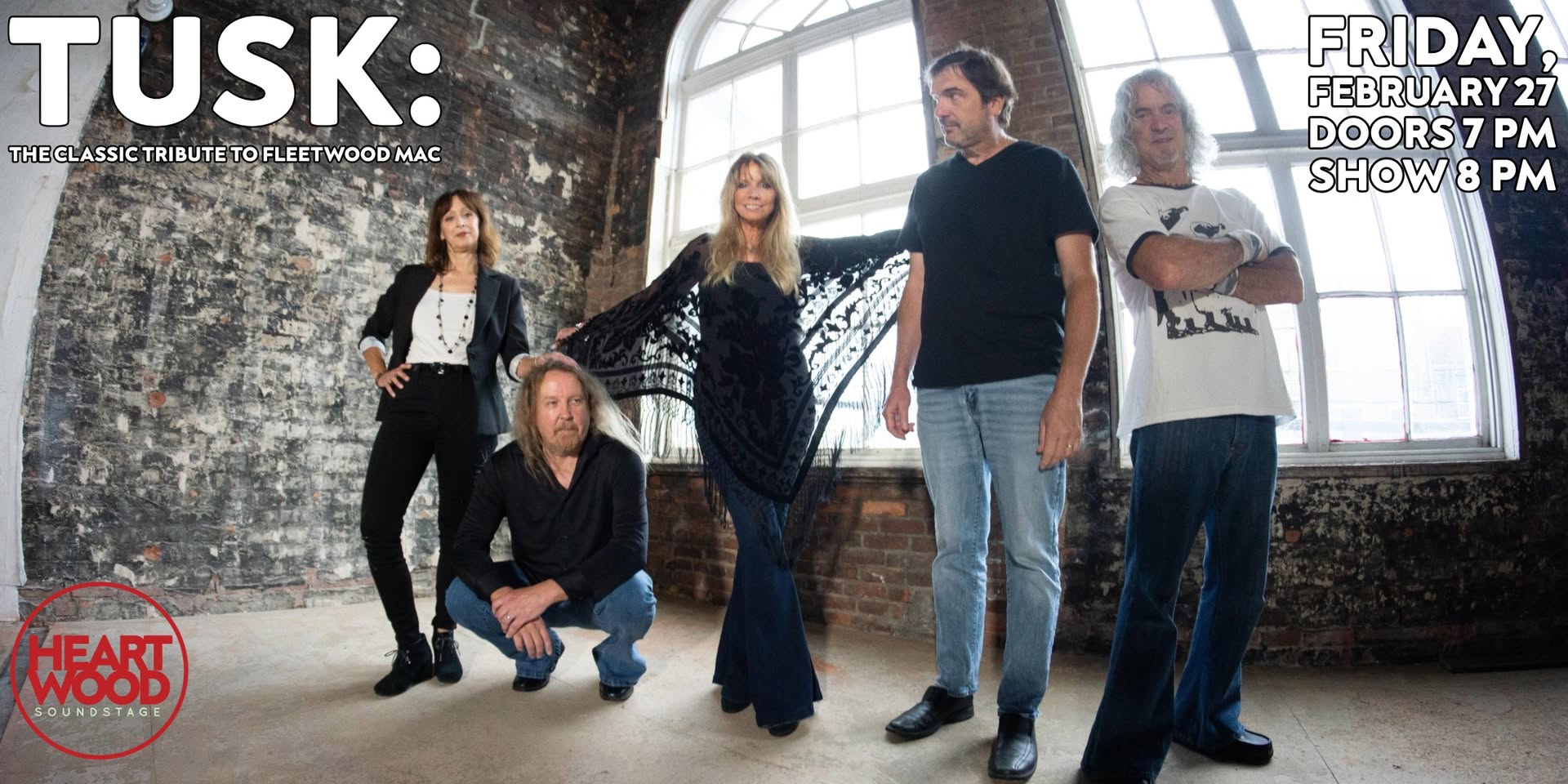 A photograph of Tusk: The Classic Tribute to Fleetwood Mac. The 5 musicians stand in an empty room with a large window behind them.